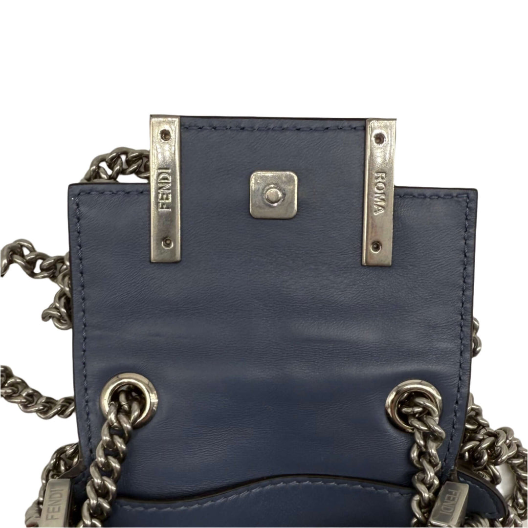 Interior view of Fendi Blue Embossed Stitched Leather Nano Baguette Crossbody Bag with silver hardware.