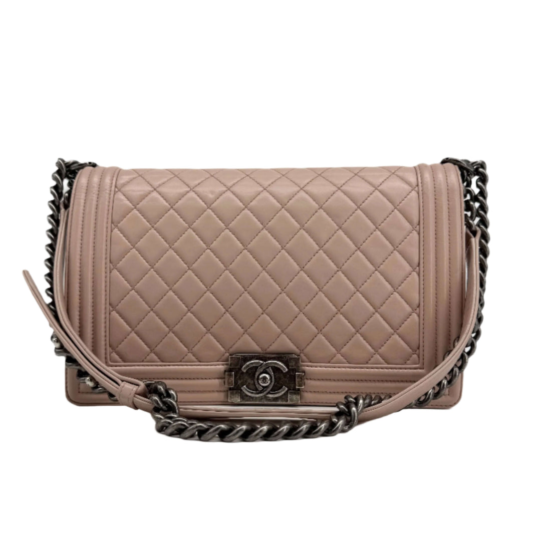 Chanel Lambskin Quilted Medium Boy Flap in Light Pink with ruthenium hardware and chain strap.