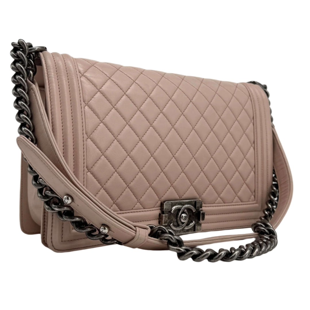 Chanel Lambskin Quilted Medium Boy Flap in Light Pink with ruthenium hardware and diamond-quilted design.