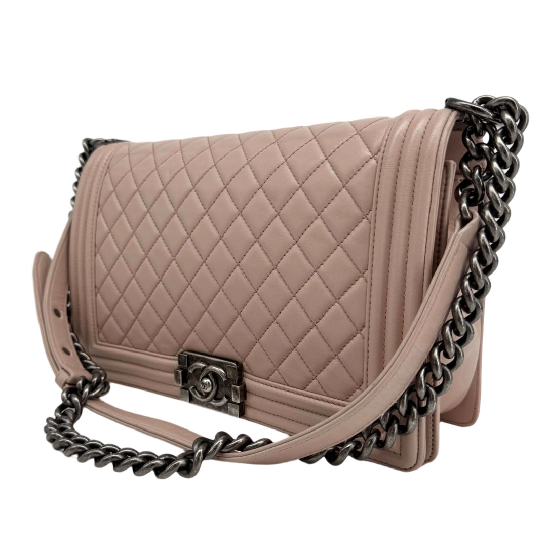 Chanel Lambskin Quilted Medium Boy Flap in Light Pink showcasing diamond-quilted leather and ruthenium hardware.