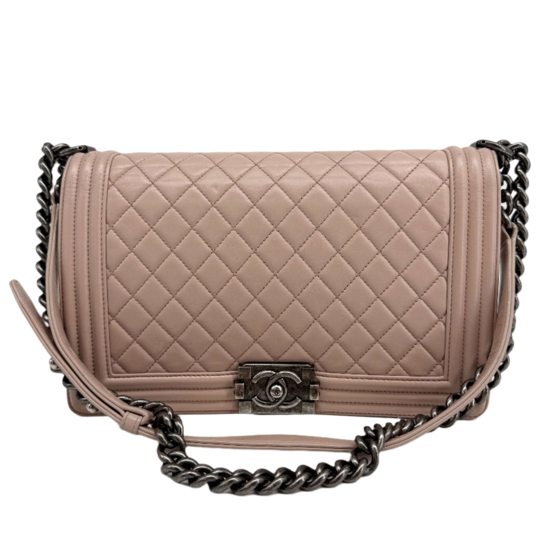 Chanel Lambskin Quilted Medium Boy Flap in Light Pink with ruthenium hardware, authentic pre-owned luxury handbag.