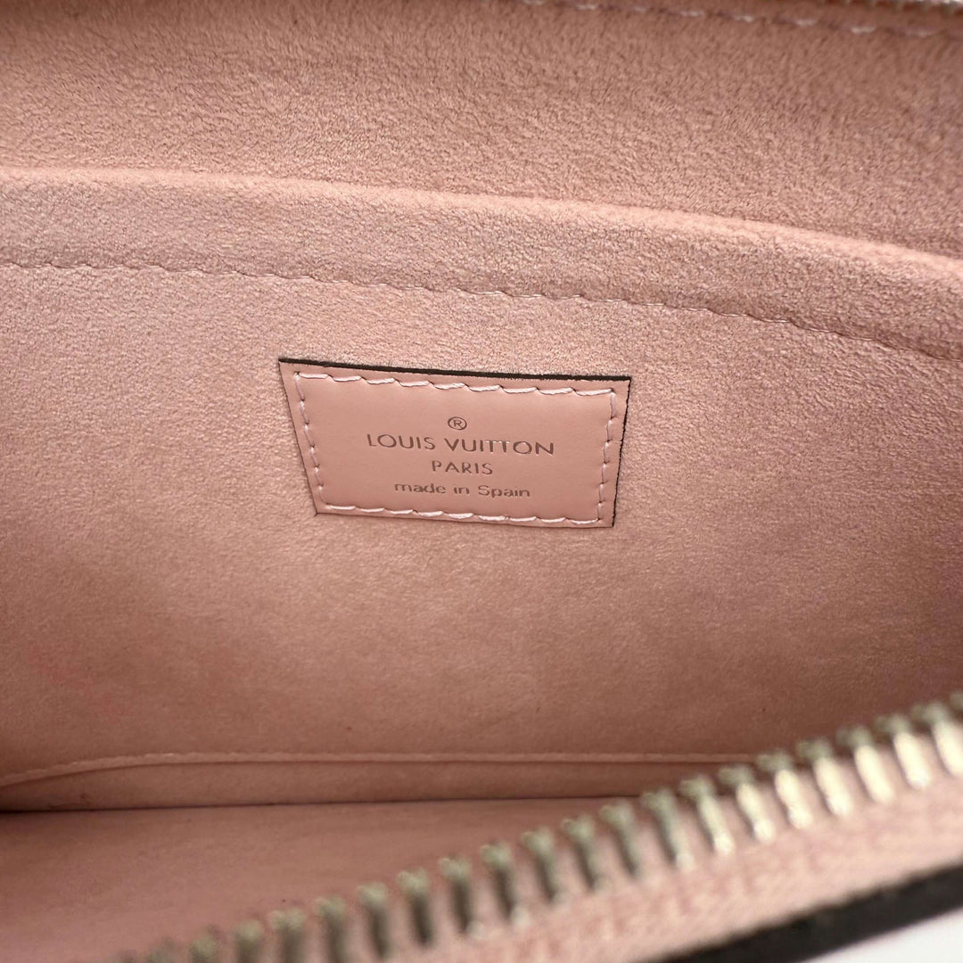 Interior view of Louis Vuitton Epi Neverfull Pochette showcasing brand label in soft pink suede.