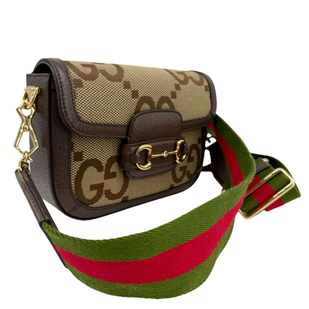 Gucci Monogram Jumbo GG Web Mini Horsebit 1955 Shoulder Bag in Camel with green and red striped strap.