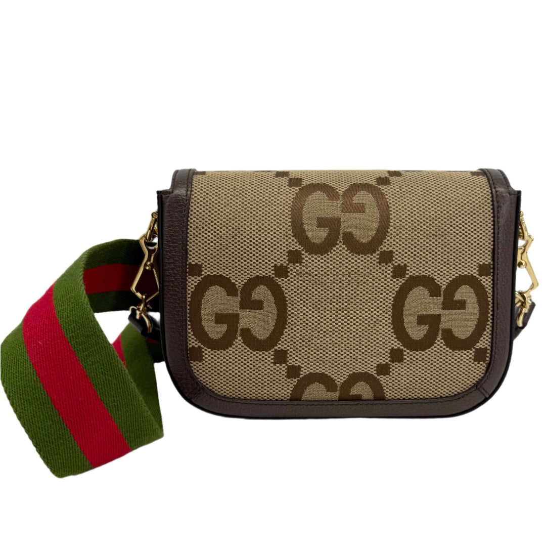 Gucci Monogram Jumbo GG Web Mini Horsebit 1955 Shoulder Bag with green and red striped strap.