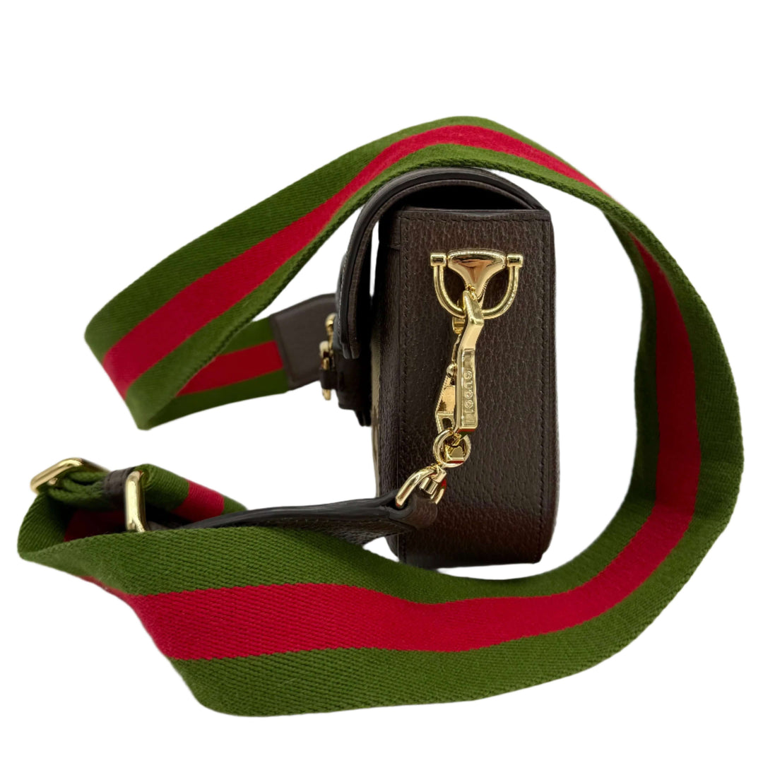 Gucci Monogram Jumbo GG Web Mini Horsebit 1955 Shoulder Bag with green and red striped strap, showcasing iconic design.