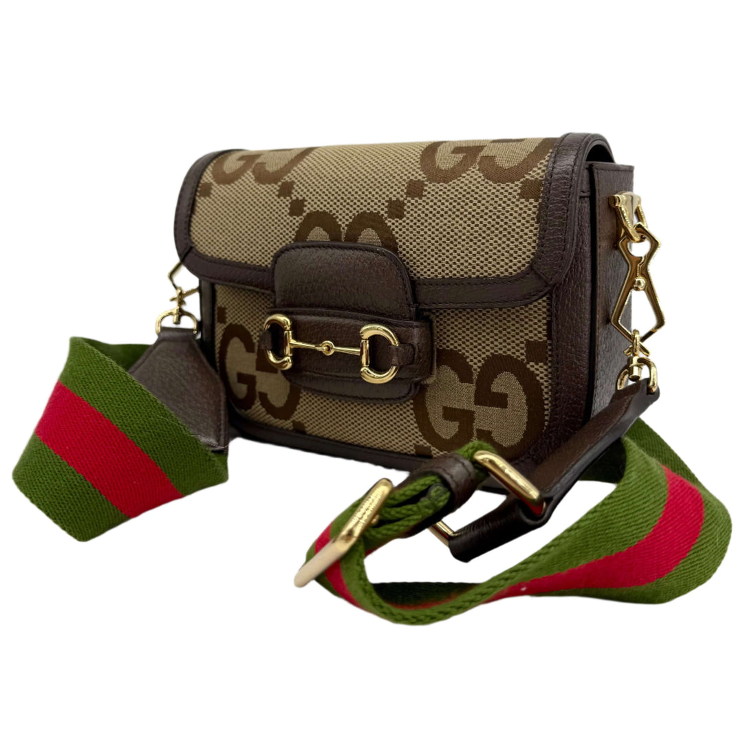 Gucci Monogram Jumbo GG Web Mini Horsebit 1955 Shoulder Bag in brown with iconic GG pattern and multi-color strap.