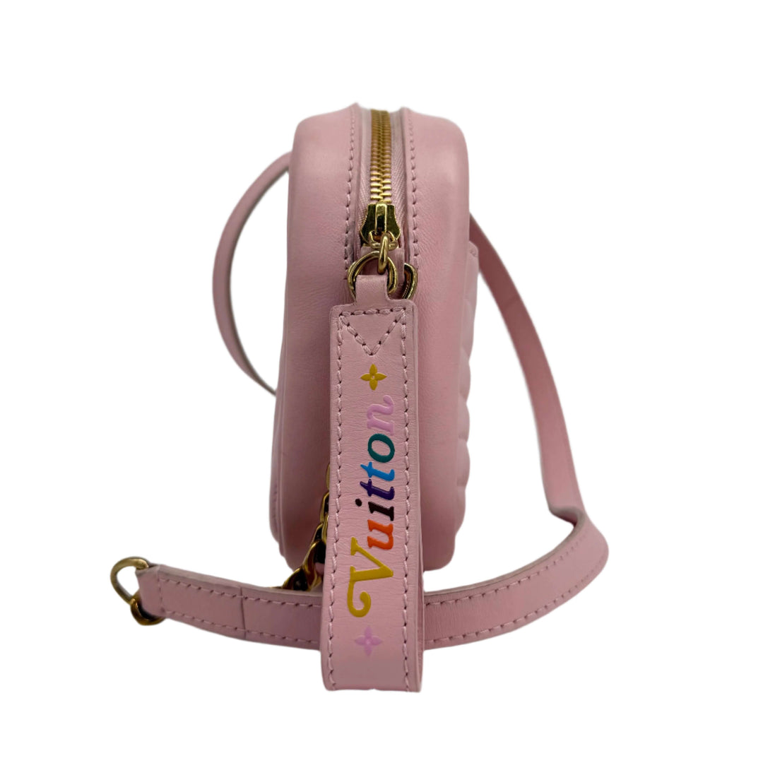 Side view of Louis Vuitton Quilted Calfskin New Wave Camera Bag in Smoothie Pink with gold hardware and colorful logo strap.