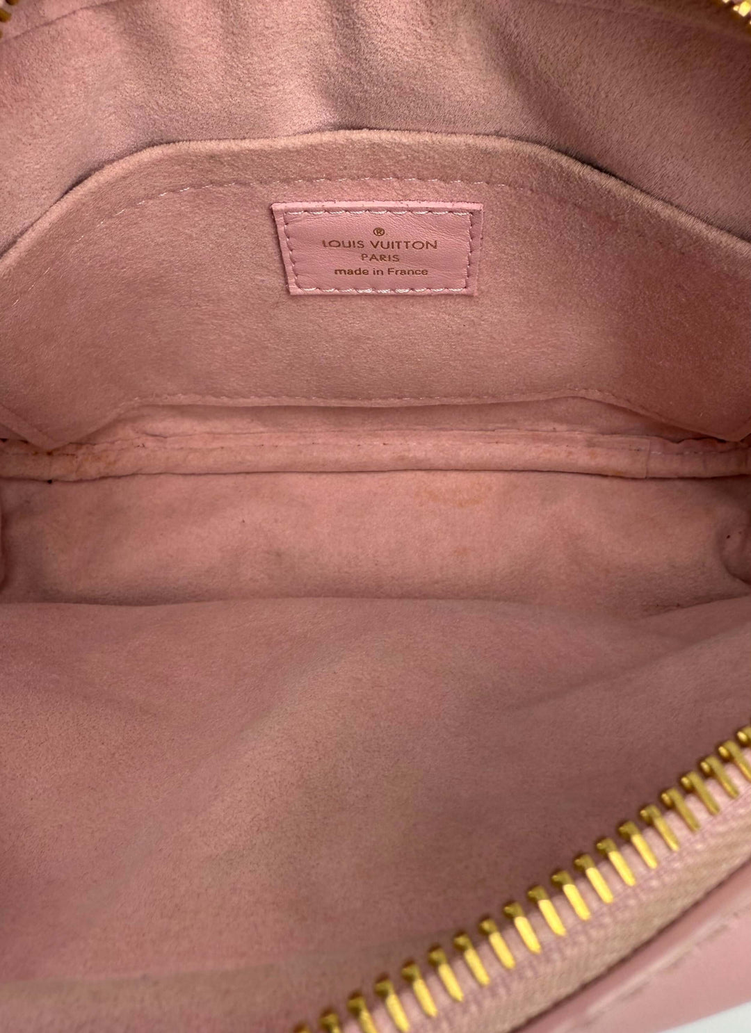 Interior of Louis Vuitton Quilted Calfskin New Wave Camera Bag in Smoothie Pink showing the soft lining and brand label.