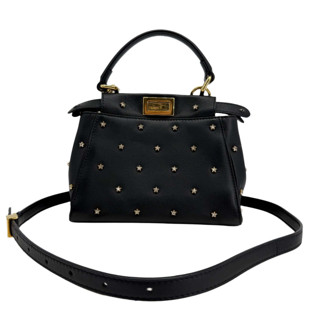 Authentic Fendi Nappa crystal studded XS Peekaboo satchel in black with star embellishments.