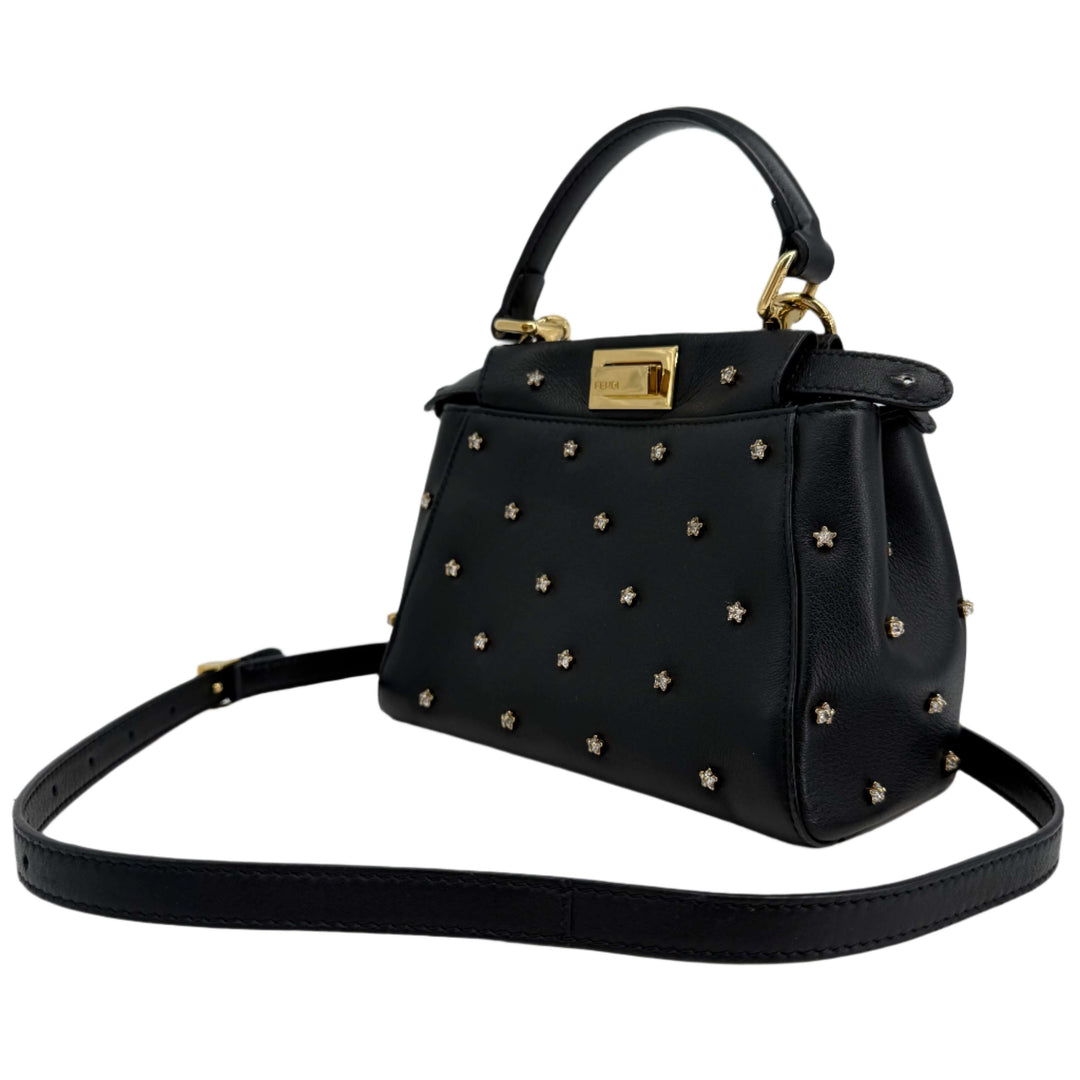 Fendi Nappa Crystal Studded XS Peekaboo Iconic Satchel in Black, featuring gold-tone hardware and star embellishments.