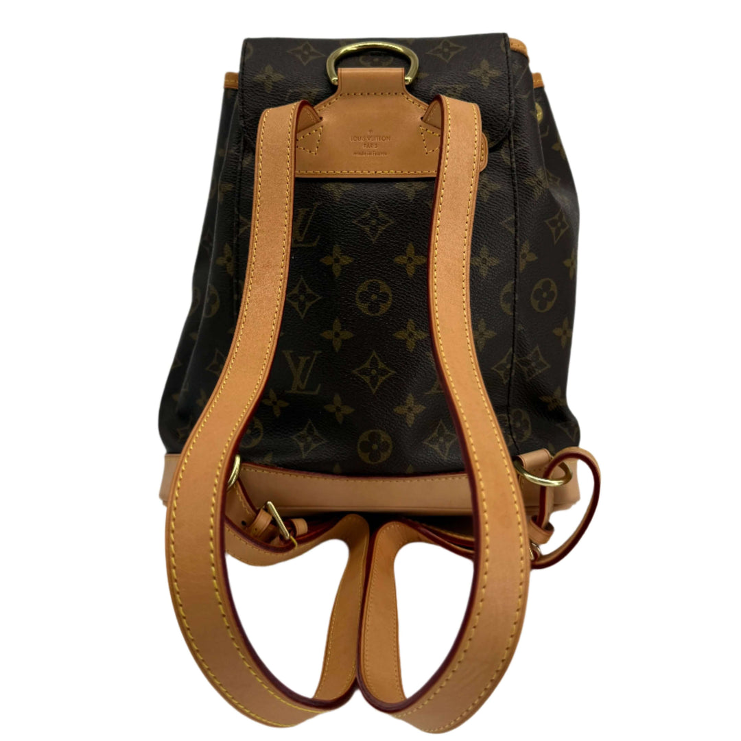 Louis Vuitton Montsouris Backpack MM in Monogram Canvas with vachetta leather trim and adjustable straps.