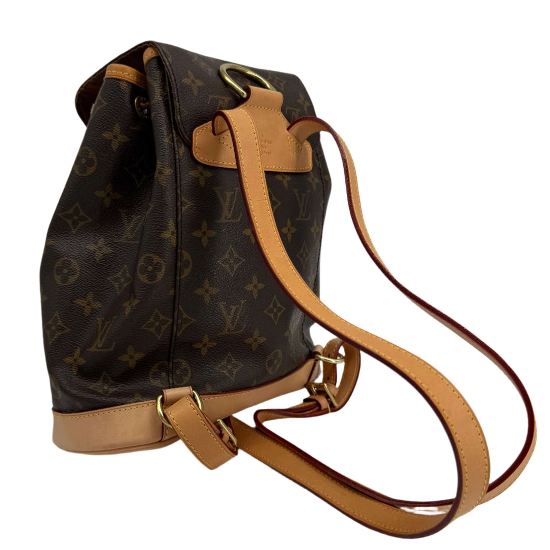 Louis Vuitton Montsouris Backpack MM in Monogram Canvas with vachetta leather trim and adjustable straps.