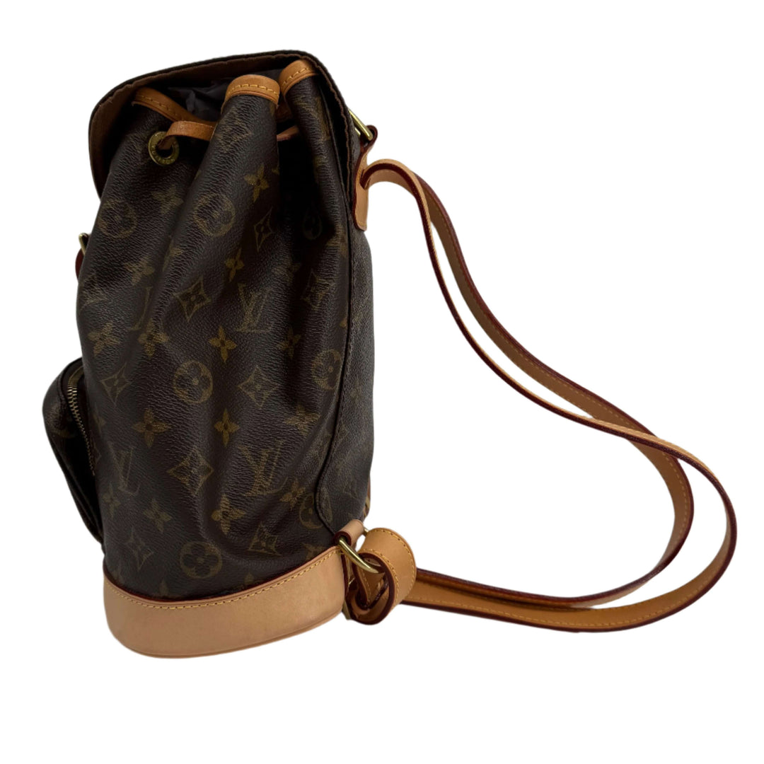 Authentic Louis Vuitton Montsouris Backpack MM in Monogram Canvas with vachetta leather trim and adjustable straps.