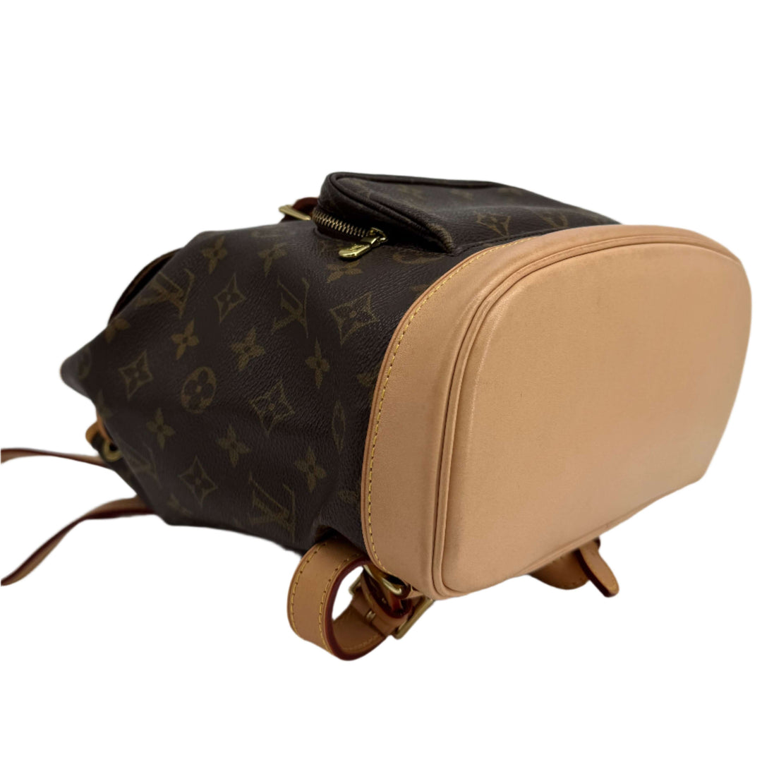 Authentic Louis Vuitton Montsouris Backpack MM in Monogram Canvas with vachetta leather trim.