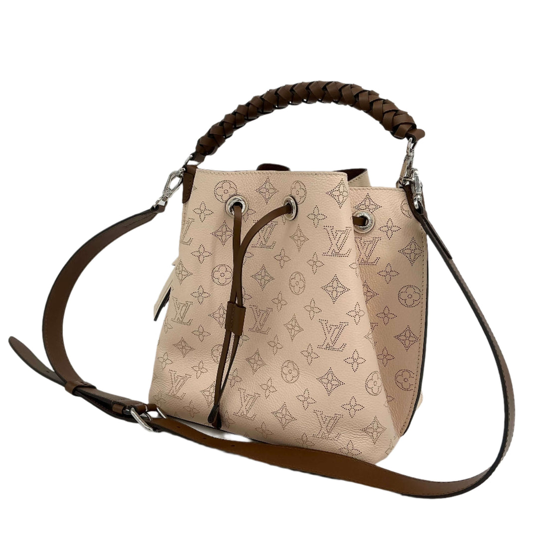 Authentic Louis Vuitton Mahina Muria in Crème with braided handle and spacious interior.