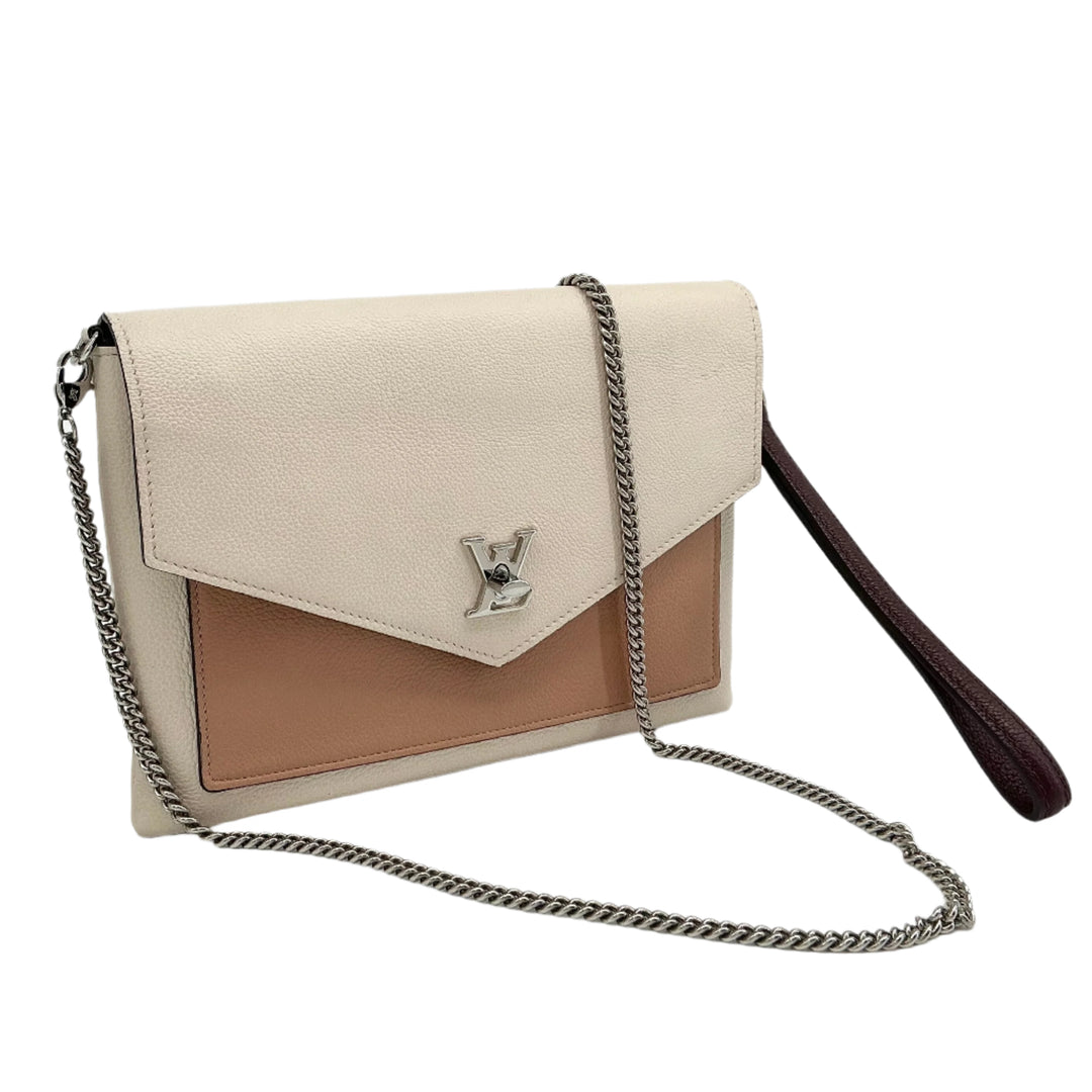 Louis Vuitton Soft Calfskin My Lockme Pochette in beige and tan, featuring a silver-tone LV twist lock and chain strap.