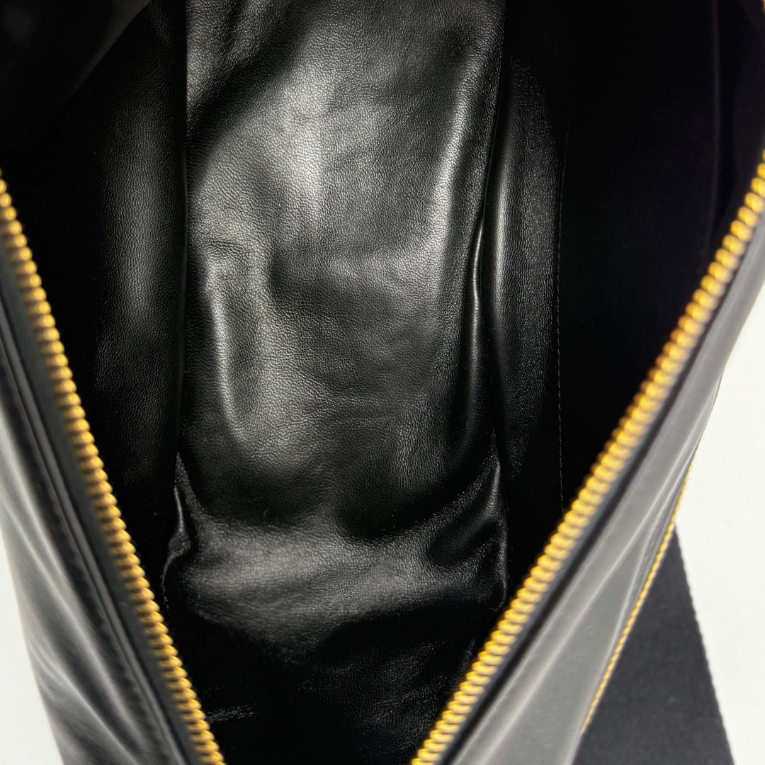 Interior view of Burberry Medium Shield Messenger Bag in Black showing premium calfskin leather lining.