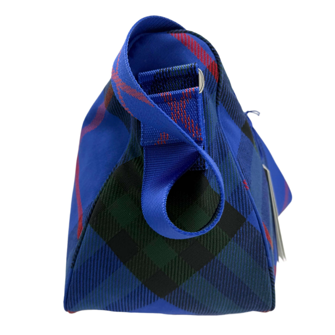 Burberry Nylon Shield Check Crossbody Bag, blue check pattern, viewed from the side, showing handle and unique design.