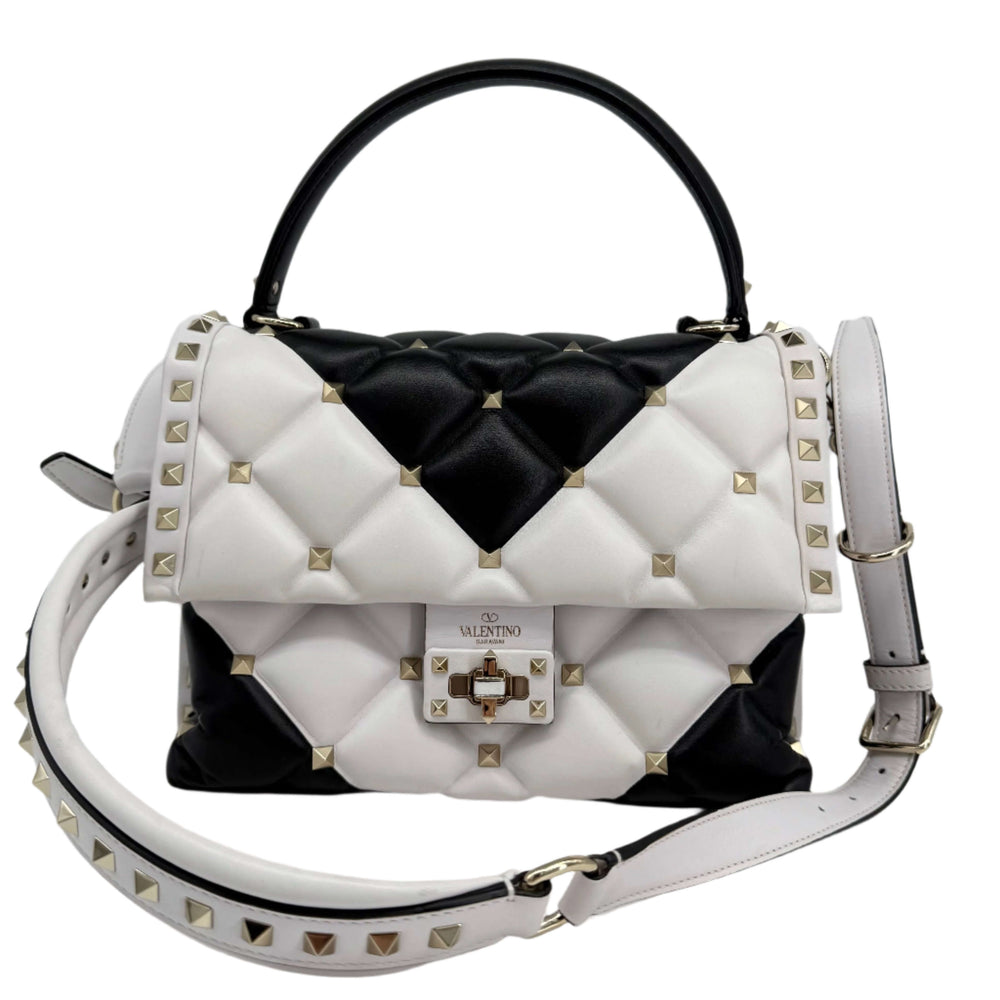 Valentino Garavani Nappa Medium Candystud Top Handle Bag in white and black with diamond quilting and stud detailing.