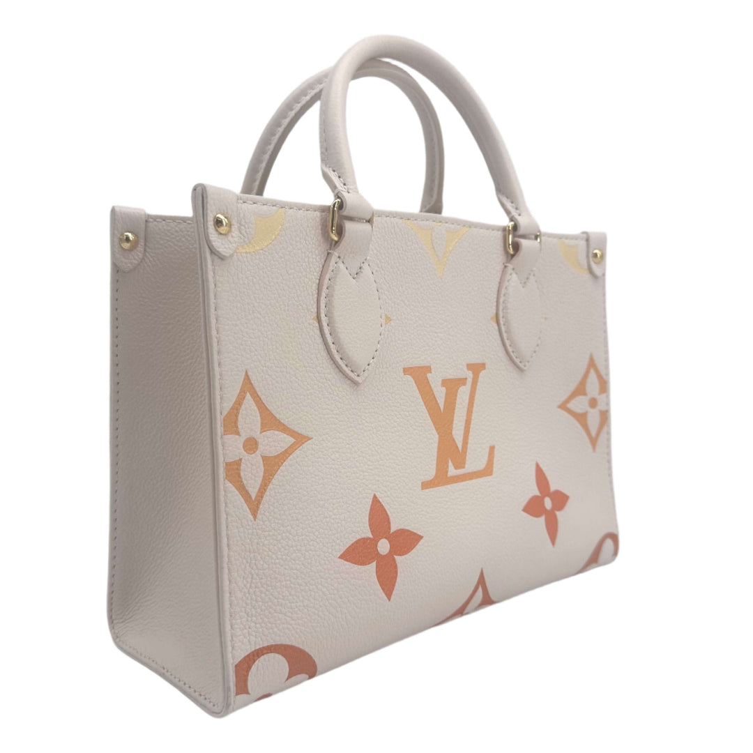 Luxury white Louis Vuitton Empreinte Monogram Giant tote bag, featuring the iconic monogram pattern and sturdy handles.