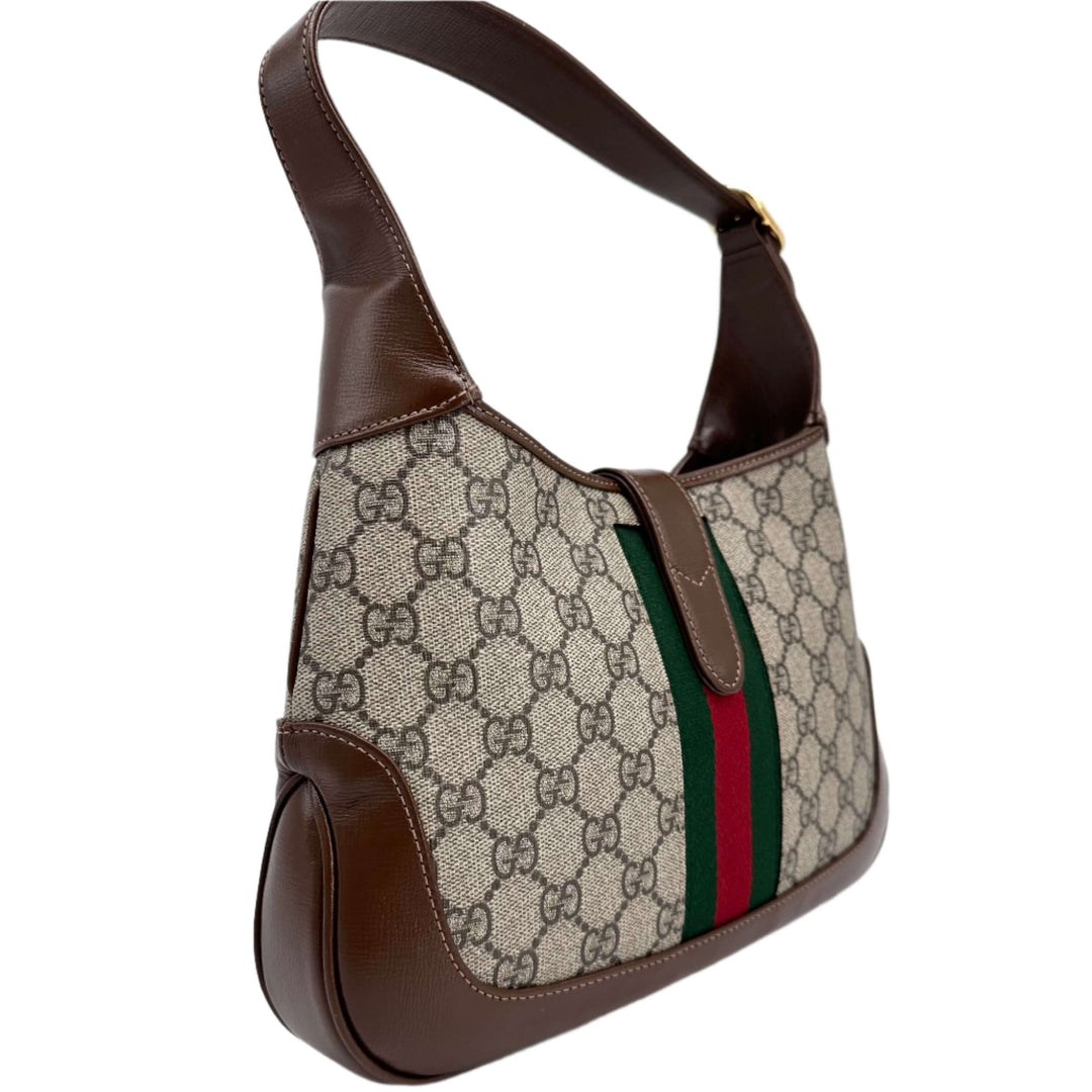 Gucci GG Supreme Monogram Small Jackie 1961 Hobo Bag in beige ebony with brown leather accents and signature green-red stripe.