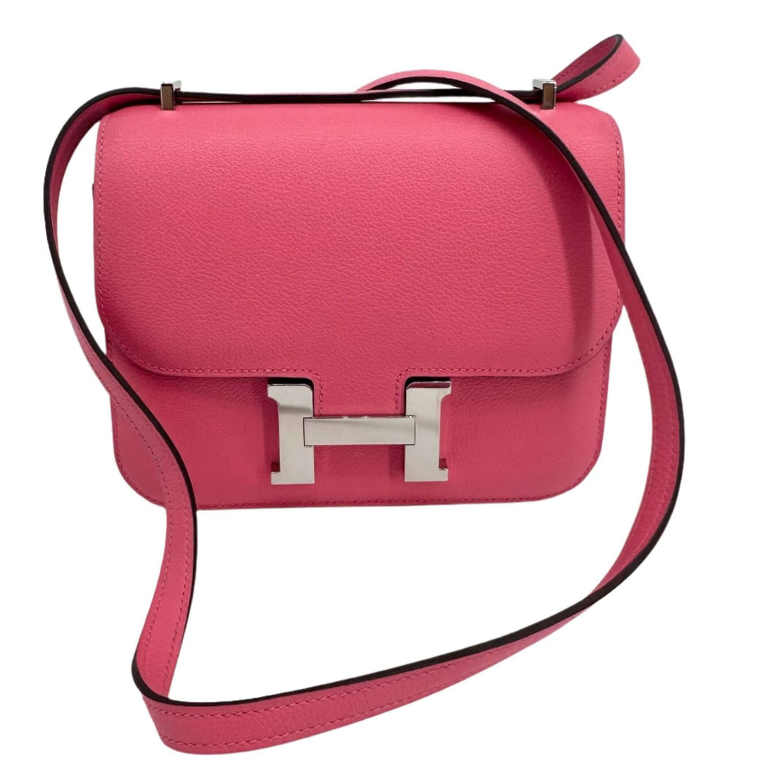 Pink HERMES Epsom Constance 24 Shoulder Bag with signature H clasp and adjustable strap.