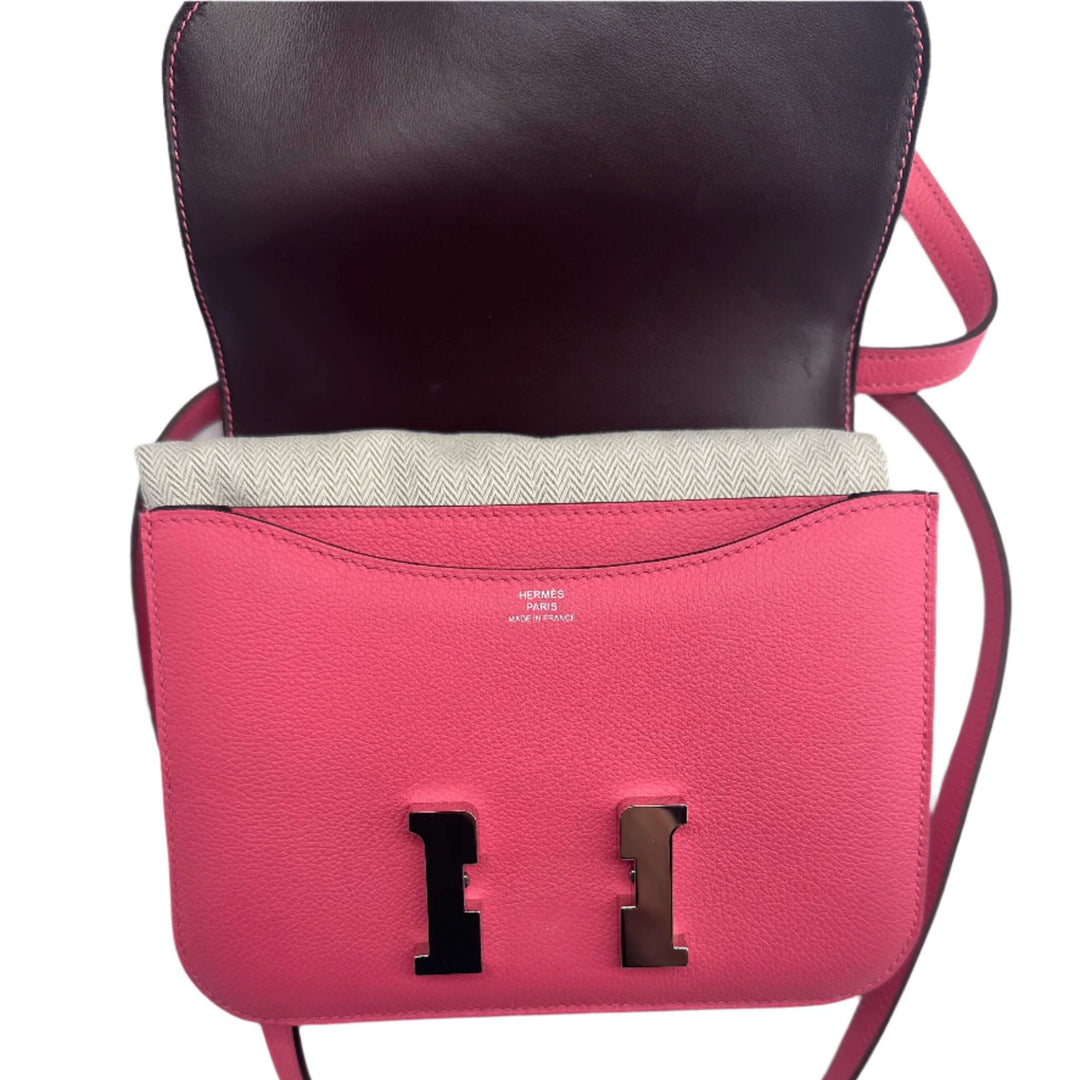 Pink HERMES Epsom Constance 24 Shoulder Bag with open flap revealing interior and iconic hardware