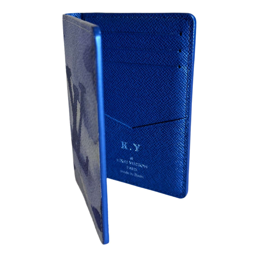 Louis Vuitton blue monogram watercolor pocket organizer in luxury leather with open view showcasing card slots and signature.