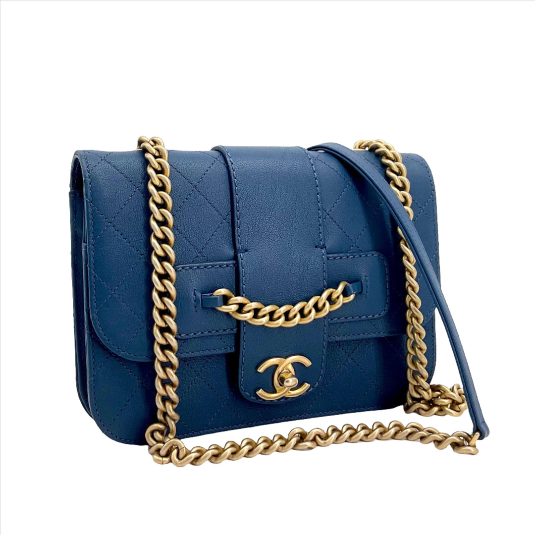 Chanel Mini Chain Front Classic Single Flap Bag in blue with gold chain detail on white background