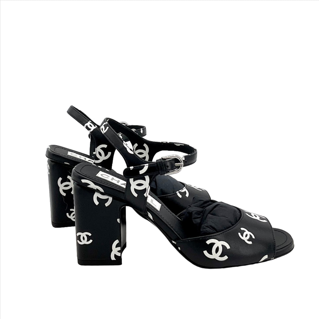 Black CHANEL Printed Lambskin CC Sandals with white CC logos, size 36, featuring a block heel and ankle strap.