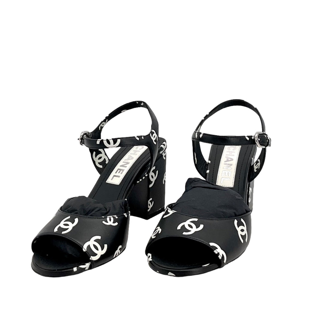 CHANEL Printed Lambskin CC Sandals in black, featuring iconic CC logo print, block heel design, and ankle strap, Size 36