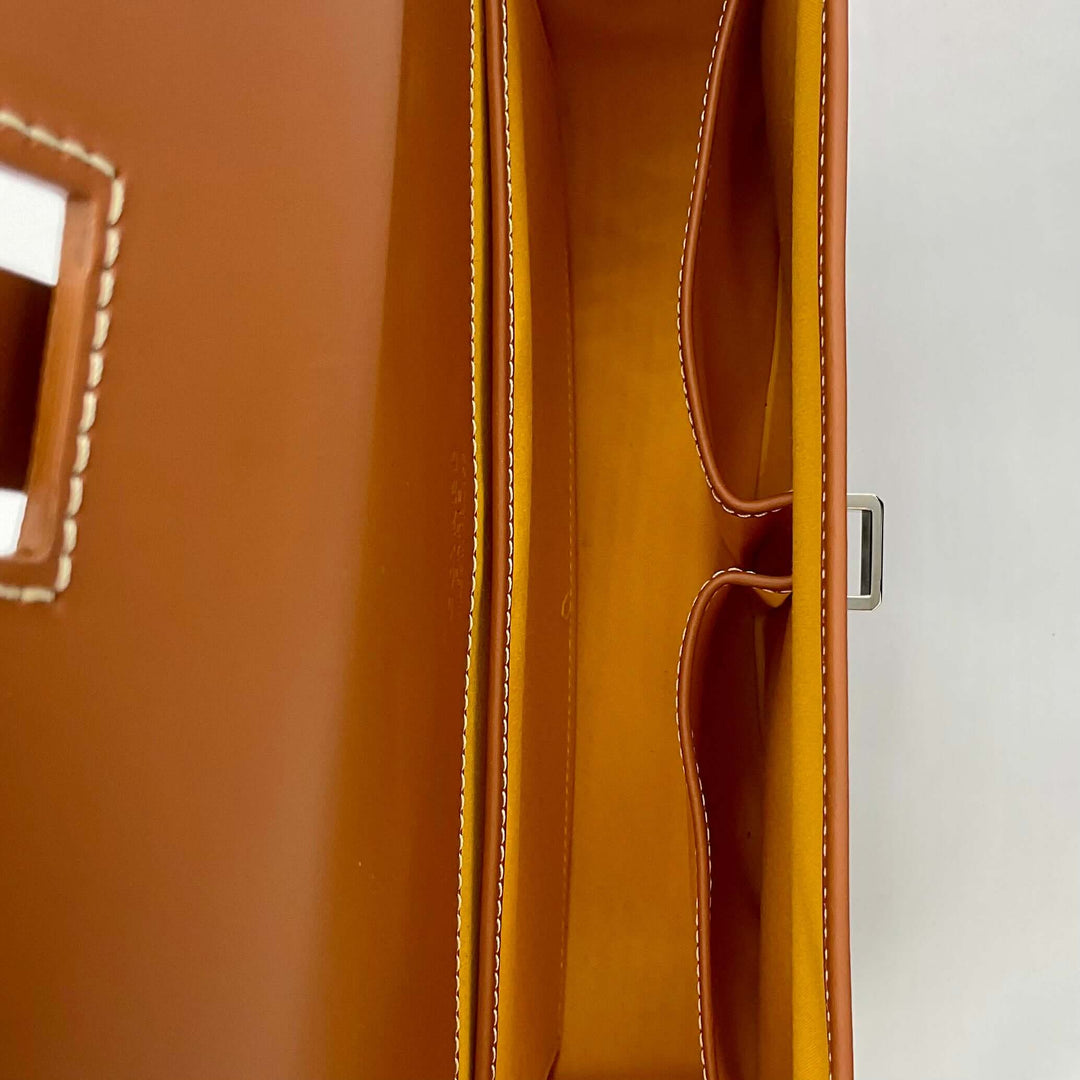 Interior view of the GOYARD Belvedere II MM Messenger bag in Black Gold, showcasing the spacious and organized compartments.